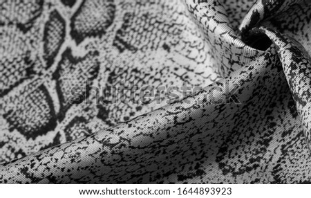 Texture, background, pattern, fabric with a pattern of gray snake skin, African fabric, design photo - safari in the country of Africa