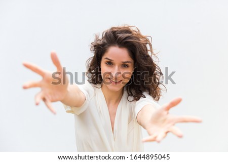 Young Woman With Arms Outstretched In A Welcoming Pose Stock Photos And Images Avopix Com