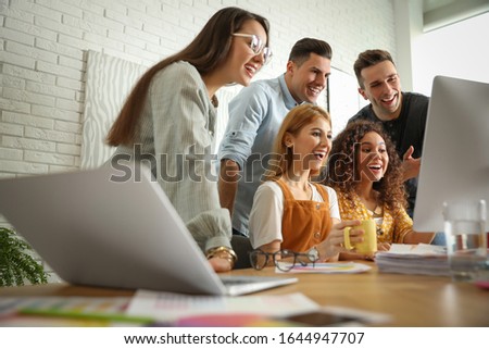 Team of professional designers working in office