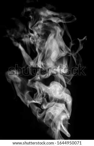 Smoke or steam on black isolated background for insertion image in overlay mode