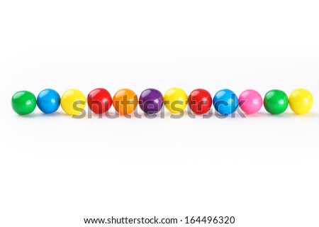 Colorful gumballs border over white background Royalty-Free Stock Photo #164496320