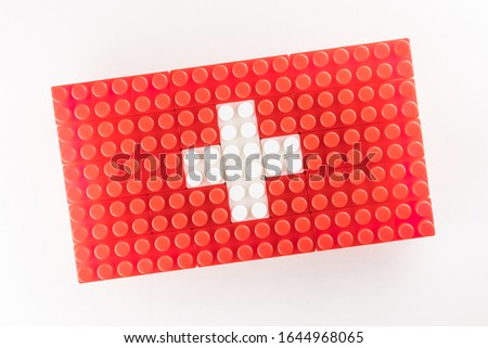 Stylized national flag of Switzerland on the white background for easy extraction maked by means of children building sets