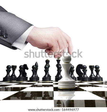 Strategy concept. hand holding white chess figure on chess board  isolated on white background High resolution 