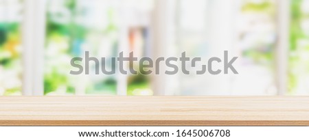 wooden table in the kitchen on the window background in the morning.