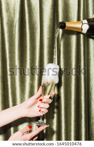 Filling a glass with sparkling Prosecco di Conegliano-Valdobbiadene, held by girl's hands.
 Royalty-Free Stock Photo #1645010476