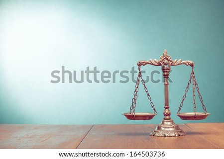 Law scales on table. Symbol of justice Royalty-Free Stock Photo #164503736