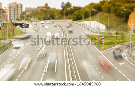 Highway traffic in an urban environment. Transport movement