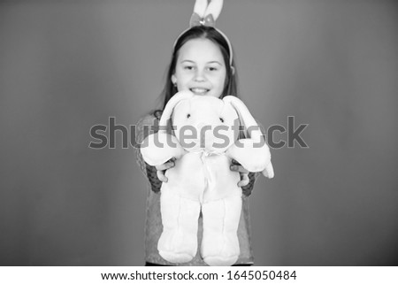 Child in rabbit bunny ears. Happy easter. Spring party. Egg hunt. Family holiday. Little girl with hare toy. Young and carefree. Rabbit's family with bunny ears. Bunny on easter day. Funny bunny.