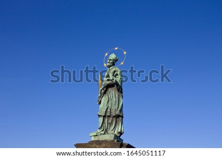Isolated religious statue with an halo in the Charles Bridge (Prague, Czech Republic, Europe)
