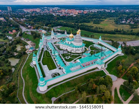 Male Orthodox monastery in Russia from a flight height, view of the temple, domes and golden crosses. Aerial photography