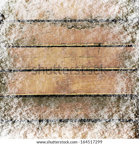 Wooden board background with snow