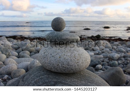 pyramid of stones on the sea