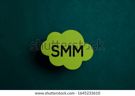 SMM write on a sticky note isolated on Office Desk