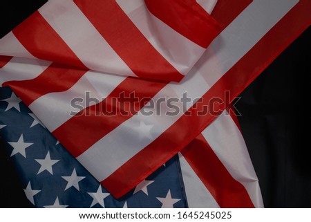 Close up of waving national usa american flag on black background with copy space for text. Concept of 4th of July or Memorial Day.