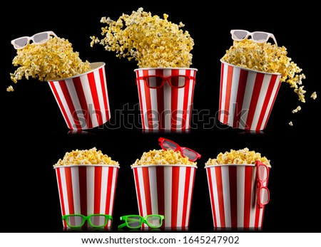 Set of buckets with popcorn and 3D glasses isolated on black background, concept of watching TV or cinema.