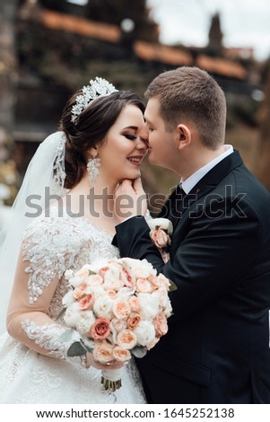 They became husband and wife this day. Beautiful young bride and groom. Lovely couple spends time. Bride and groom on their wedding, photo session. Lovely couple spends time.