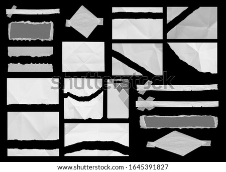 Set of torn paper texture on black background, copy space.