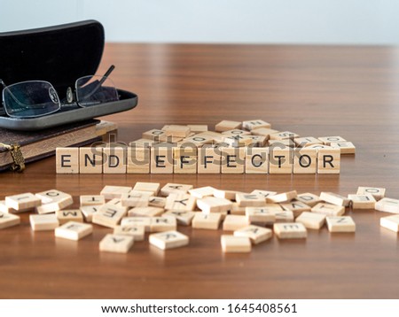 end effector concept represented by wooden letter tiles Royalty-Free Stock Photo #1645408561