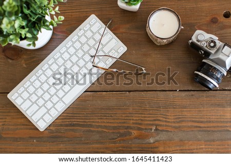 Lay flat wood desk keyboard camera