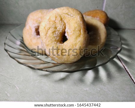 sweet donut on a clear plate