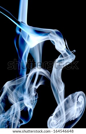 Blue smoke on natural black background