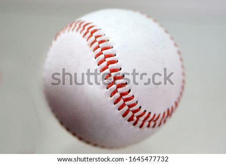 Closeup of baseball or white ball with stitches                               