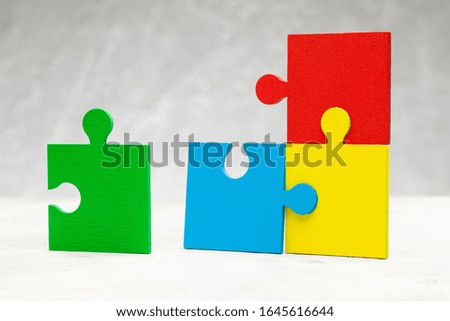 The colored part of the puzzle. Concept of team support and partner help.