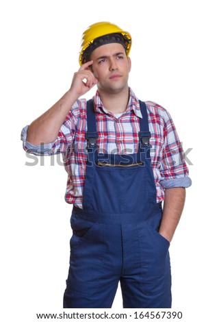 Standing construction worker thinking about the project