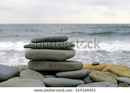 Balanced stones on the sea background