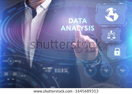 Business, Technology, Internet and network concept. Young businessman working on a virtual screen of the future and sees the inscription: Data analysis