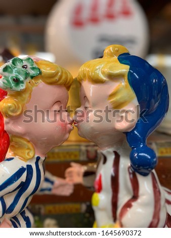 Dutch figurines kissing with intentionally blurry backgrounds.  Antiques and vintage