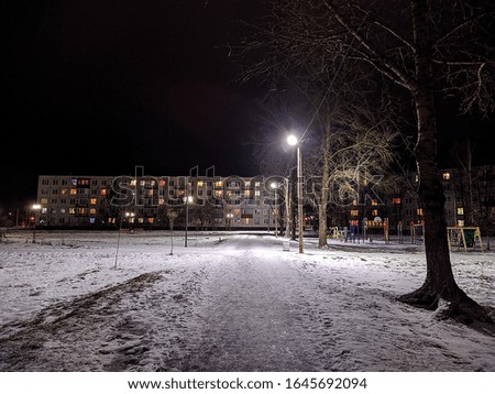 night illumination of a small and calm city in the winter season