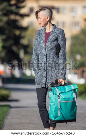 young woman in the city, stroll, sightseeing, enjoy and relax on a sunny spring or summer, autumn day
