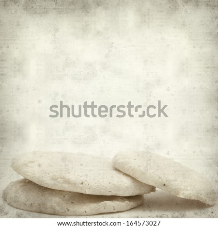 textured old paper background with macaroon cookie