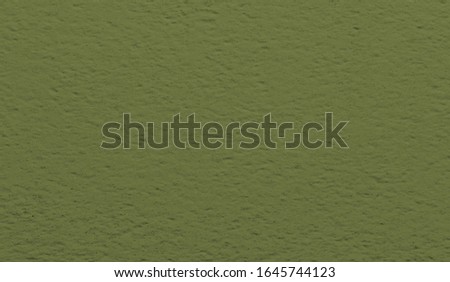 Dark olive ceramic tile for wall and floor decoration. Concrete stone surface background. Stucco solid texture for interior design project.
