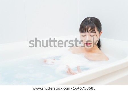 Young woman in the bath