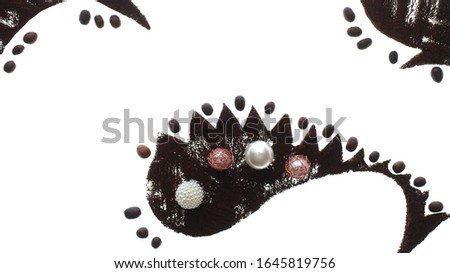 photo composition with ground coffee and pearl beads on a white background