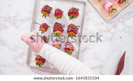 Flat lay. Step by step. Garnishing chocolate dipped strawberries with drizzled chocolate.