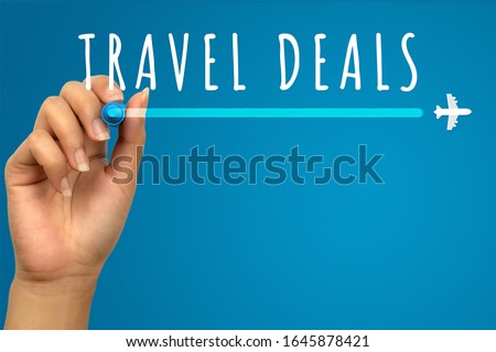 Vacation travel deals hand written text on blue background with copy space - Flight promotional flash sale banner with airplane icon - Retail web advertising holiday airline ticket business concept