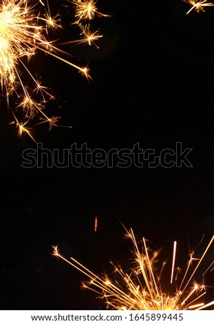 A burning sparkler/fireworks background design or creative template. 