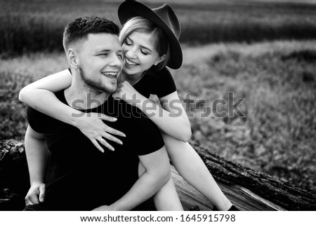 Black and white photos of love story on the field 
