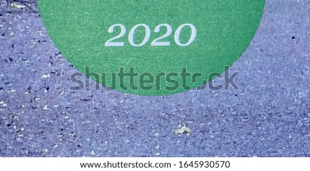"2020" in white on a green and grey background from the cover of a journal produced that year. The posterisation is part of the original print