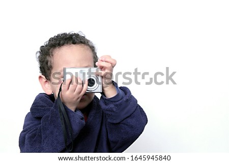 child holding camera with white background stock photo