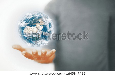 Man holding a glowing earth globe in his hands. 3d rendering