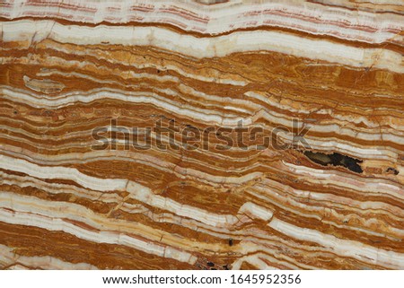Natural onyx stone with beautiful stripes of white and red color is called Onice Tiger