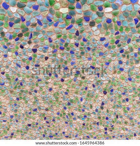 Different size and shape of broken, colorful glass shards. Abstract glass background