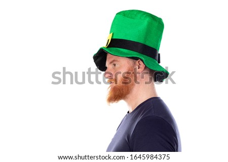 Profile of a redhead man with big green hat isolated on a white background
