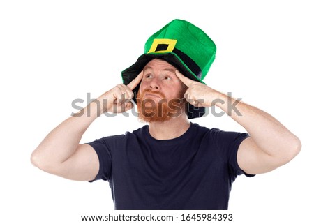 Redhead man with green hat thinking about something isolated on a white background