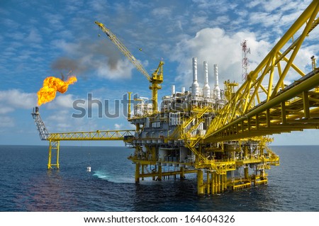 Oil and gas platform with gas burning, Power energy. Royalty-Free Stock Photo #164604326