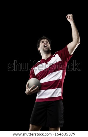 Rugby player in a red uniform. Black Background